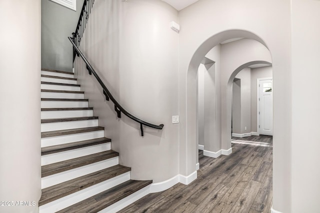20866 W Werner Pl, Buckeye, AZ 85396 - stairs with wood finished floors, baseboards, and arched walkways