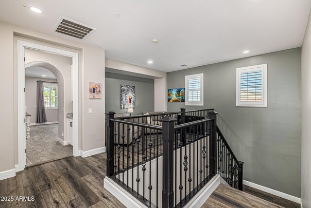 20866 W Werner Pl, Buckeye, AZ 85396 - stairs featuring wood finished floors, arched walkways, baseboards, and recessed lighting