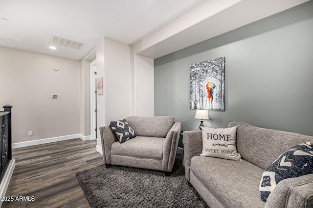 20866 W Werner Pl, Buckeye, AZ 85396 - living room featuring dark wood-style flooring and baseboards