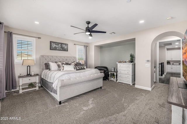 20866 W Werner Pl, Buckeye, AZ 85396 - carpeted bedroom with multiple windows, arched walkways, baseboards, recessed lighting, and a ceiling fan