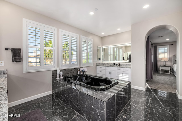 20866 W Werner Pl, Buckeye, AZ 85396 - full bathroom with marble tiled flooring, baseboards, a garden tub, vanity, and recessed lighting