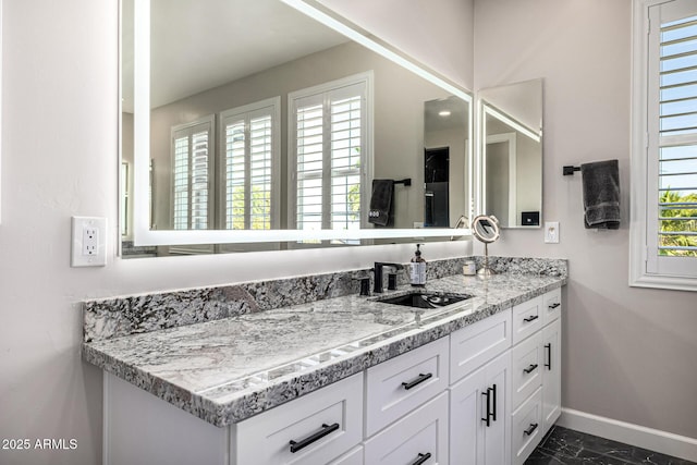 20866 W Werner Pl, Buckeye, AZ 85396 - bathroom with baseboards, vanity, and marble finish flooring