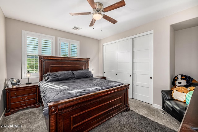 20866 W Werner Pl, Buckeye, AZ 85396 - bedroom with dark colored carpet, baseboards, a closet, and ceiling fan