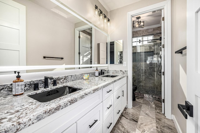 20866 W Werner Pl, Buckeye, AZ 85396 - full bath featuring marble finish floors, a stall shower, double vanity, toilet, and baseboards