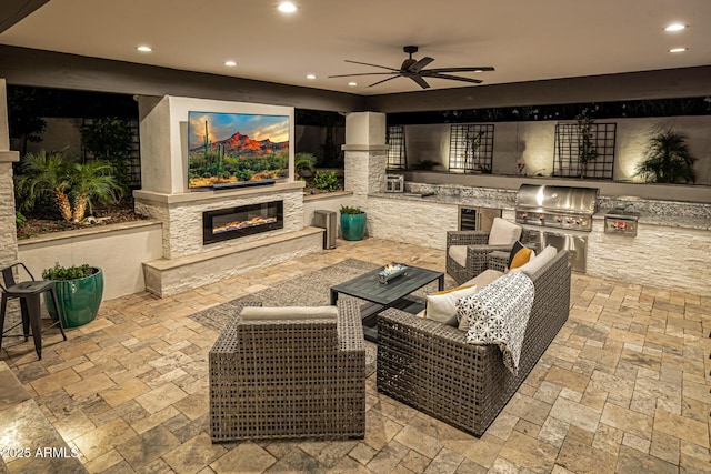 20866 W Werner Pl, Buckeye, AZ 85396 - view of patio featuring a glass covered fireplace and a ceiling fan