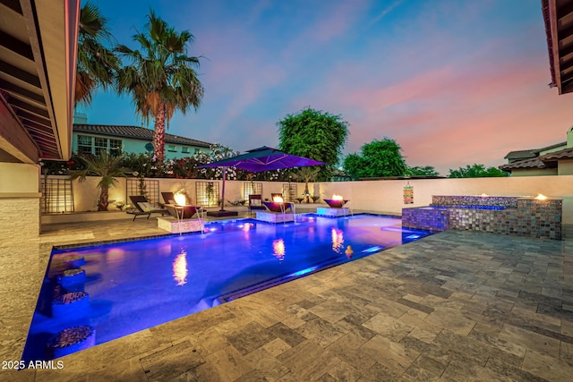 20866 W Werner Pl, Buckeye, AZ 85396 - pool at dusk featuring a patio area and a fenced backyard