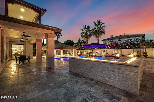 20866 W Werner Pl, Buckeye, AZ 85396 - view of patio / terrace with an outdoor fire pit, a ceiling fan, and outdoor dining area