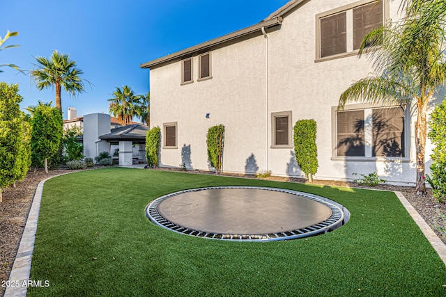 20866 W Werner Pl, Buckeye, AZ 85396 - view of green lawn with a trampoline