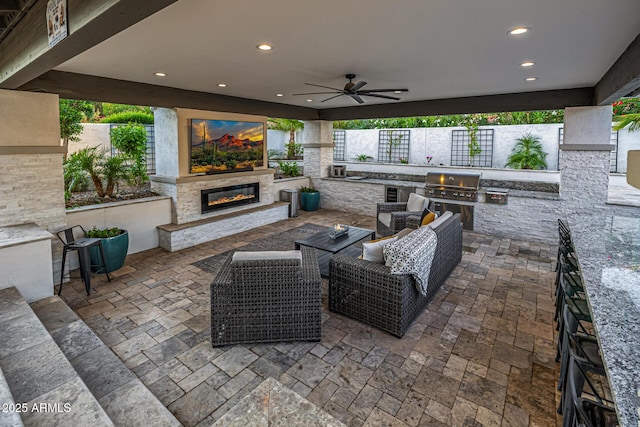 20866 W Werner Pl, Buckeye, AZ 85396 - view of patio / terrace featuring an outdoor living space with a fireplace and ceiling fan