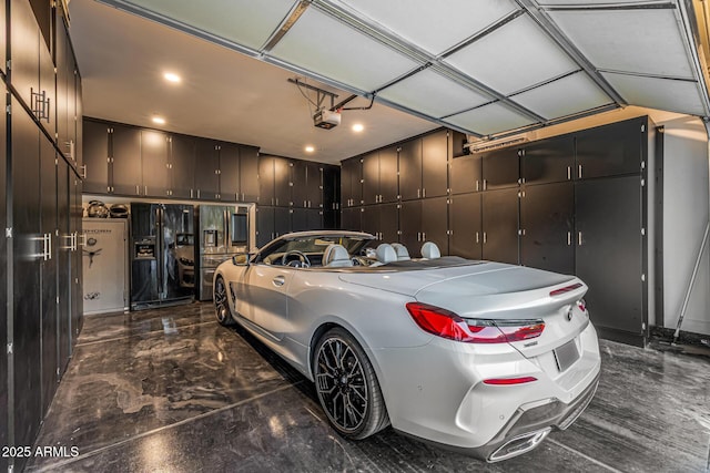 20866 W Werner Pl, Buckeye, AZ 85396 - garage featuring black refrigerator with ice dispenser, a garage door opener, and recessed lighting