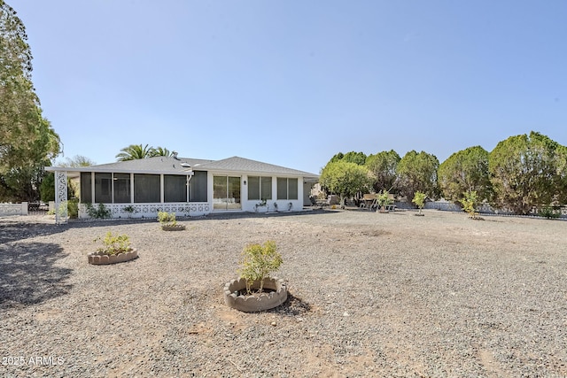 rear view of house with a sunroom