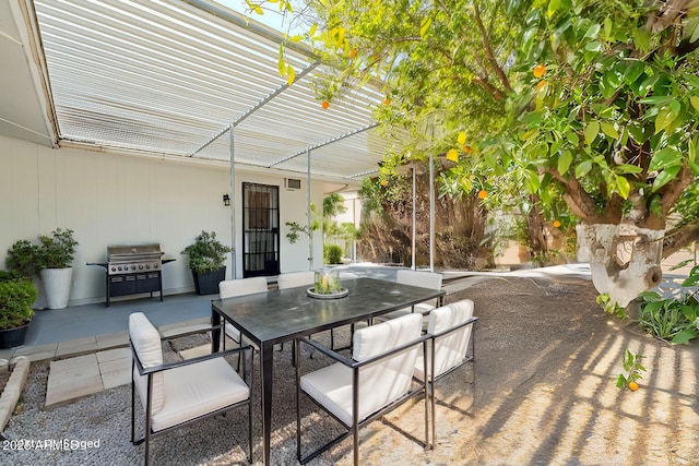 view of patio / terrace with outdoor dining area and a grill