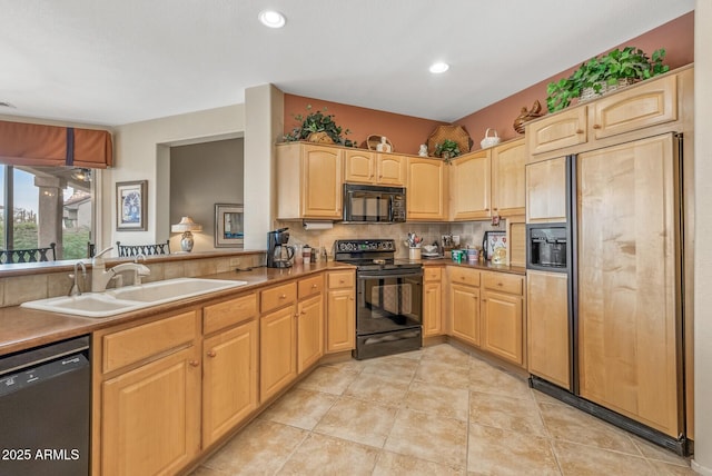 kitchen with light tile patterned flooring, sink, decorative backsplash, black appliances, and light brown cabinets