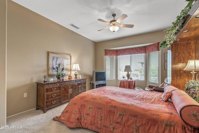 bedroom with light carpet and ceiling fan