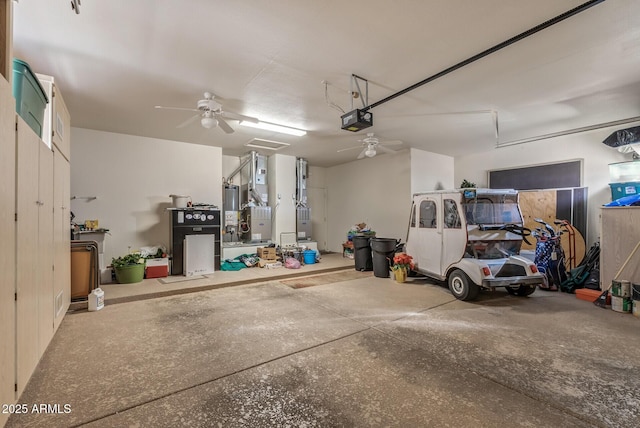 garage with a garage door opener, water heater, and ceiling fan