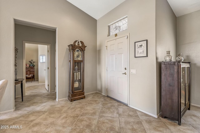 entryway with vaulted ceiling and a healthy amount of sunlight