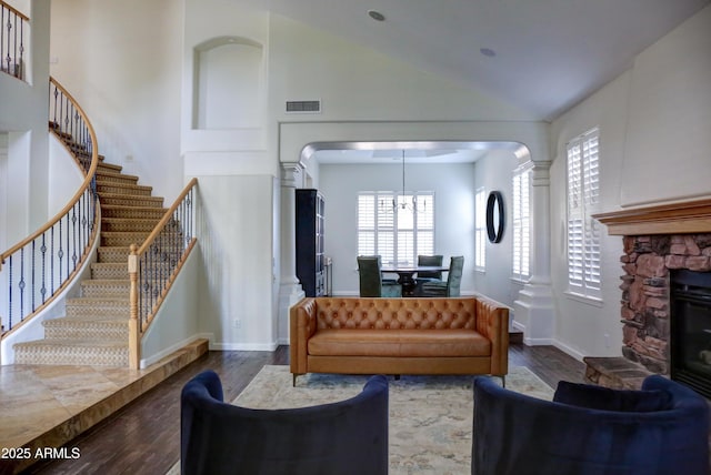 1707 E Carob Dr, Chandler, AZ 85286 - living area with stairs, dark wood-style flooring, plenty of natural light, high vaulted ceiling, and a chandelier