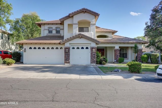 1707 E Carob Dr, Chandler, AZ 85286 - view of front of house featuring an attached garage, stucco siding, driveway, and a tile roof
