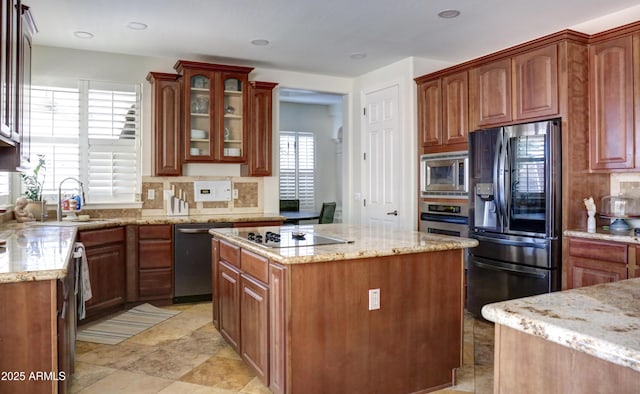 1707 E Carob Dr, Chandler, AZ 85286 - kitchen featuring appliances with stainless steel finishes, a sink, decorative backsplash, light stone counters, and recessed lighting