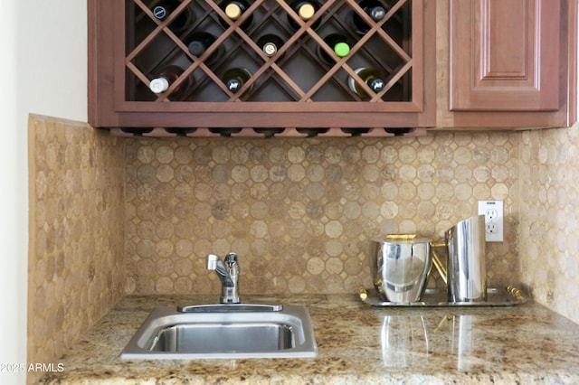 1707 E Carob Dr, Chandler, AZ 85286 - kitchen with a sink, backsplash, and light stone countertops