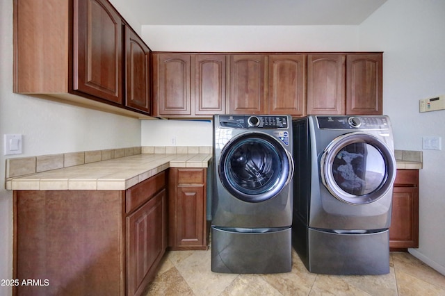 1707 E Carob Dr, Chandler, AZ 85286 - laundry area featuring cabinet space, washing machine and dryer, and light tile patterned floors