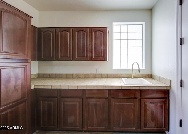 1707 E Carob Dr, Chandler, AZ 85286 - kitchen featuring a sink, tile countertops, and dark brown cabinetry