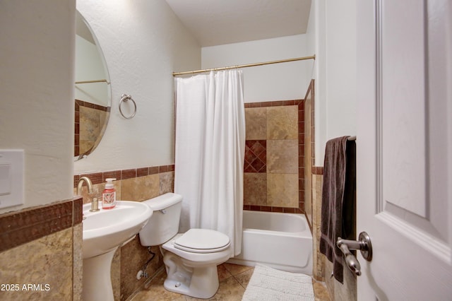 1707 E Carob Dr, Chandler, AZ 85286 - bathroom with toilet, tile walls, shower / bath combination with curtain, tile patterned flooring, and wainscoting