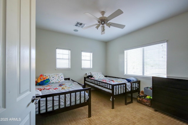 1707 E Carob Dr, Chandler, AZ 85286 - bedroom with light carpet and a ceiling fan