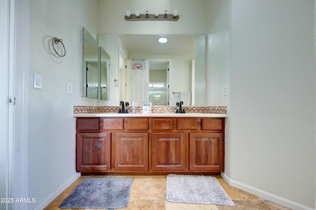 1707 E Carob Dr, Chandler, AZ 85286 - full bathroom featuring baseboards, double vanity, and tile patterned flooring