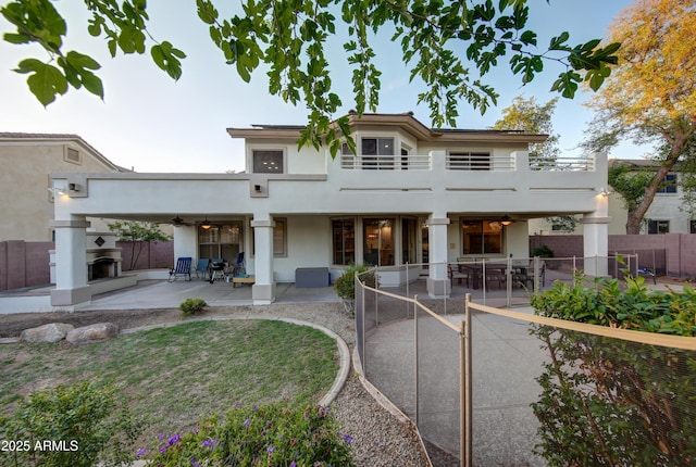 1707 E Carob Dr, Chandler, AZ 85286 - view of front of property with a ceiling fan, stucco siding, and a balcony