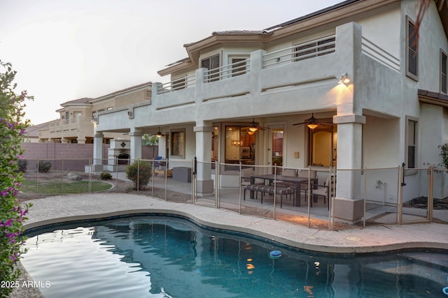 1707 E Carob Dr, Chandler, AZ 85286 - back of house with a balcony, a patio, a ceiling fan, fence, and stucco siding