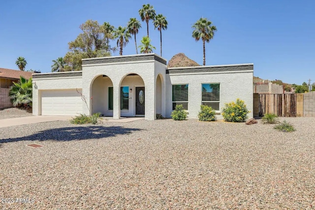 mediterranean / spanish-style house featuring a garage