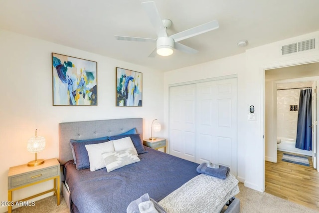 bedroom featuring hardwood / wood-style floors, a closet, and ceiling fan