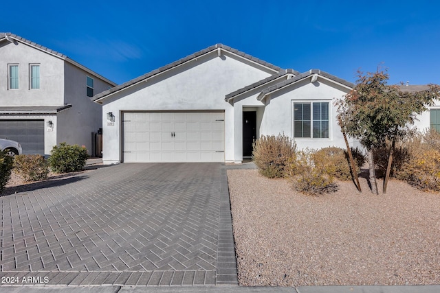 view of front of property with a garage