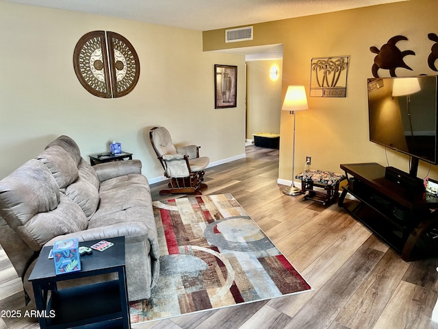 living room with wood-type flooring