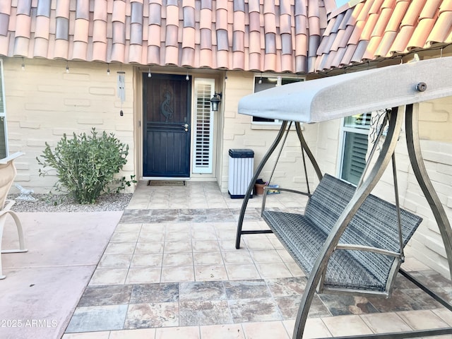 doorway to property featuring a patio