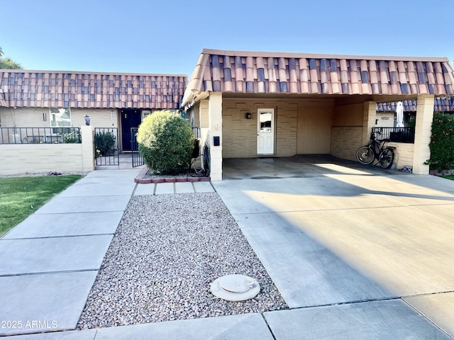 view of front of home featuring a carport