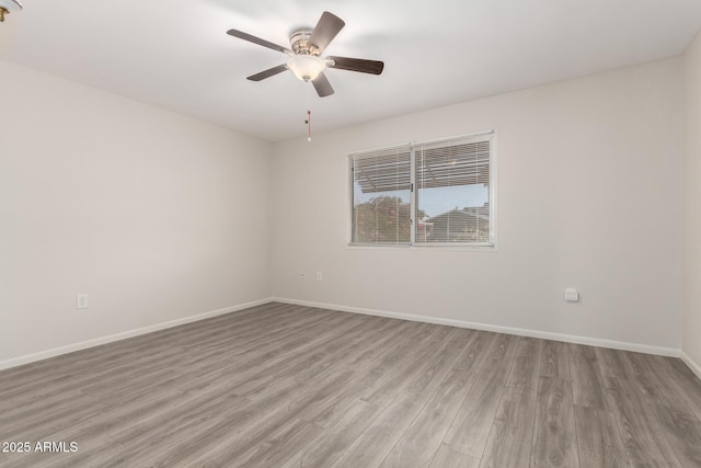 9603 W Calico Dr, Sun City, AZ 85373 - spare room featuring wood finished floors and ceiling fan