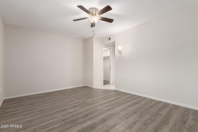 9603 W Calico Dr, Sun City, AZ 85373 - empty room featuring ceiling fan and wood finished floors