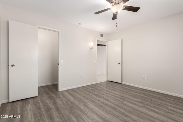 9603 W Calico Dr, Sun City, AZ 85373 - unfurnished bedroom with wood finished floors and ceiling fan