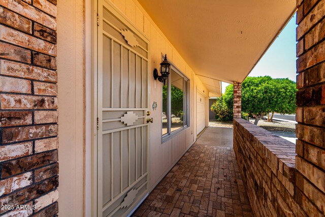 9603 W Calico Dr, Sun City, AZ 85373 - view of exterior entry featuring covered porch