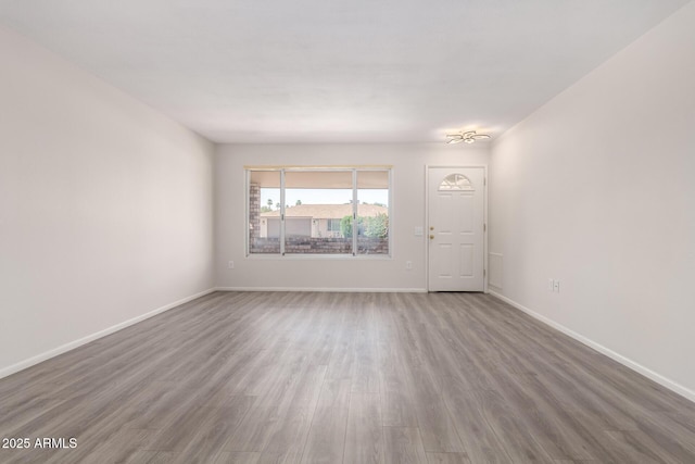 9603 W Calico Dr, Sun City, AZ 85373 - spare room with wood finished floors and baseboards