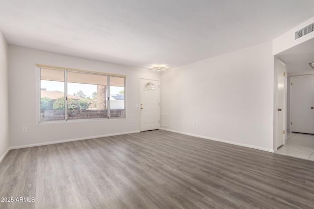 9603 W Calico Dr, Sun City, AZ 85373 - unfurnished room featuring wood finished floors