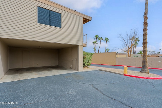 view of car parking with fence