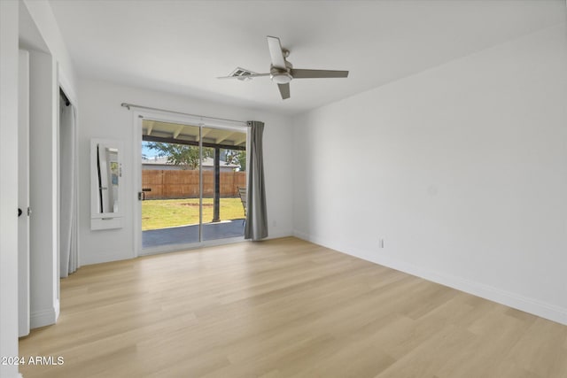 empty room with light hardwood / wood-style floors and ceiling fan