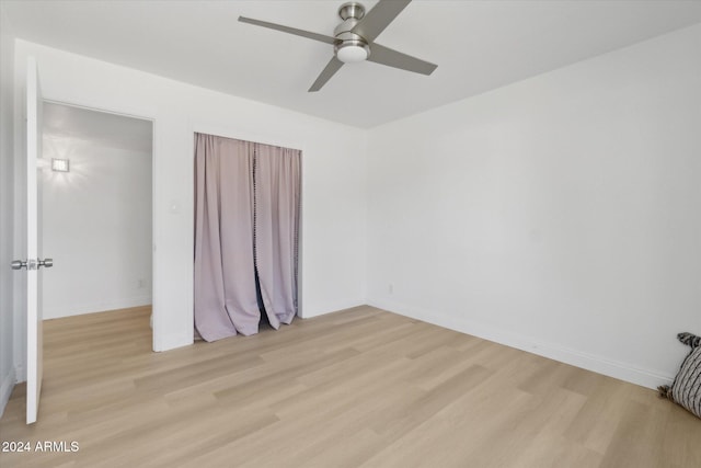 empty room featuring light hardwood / wood-style floors and ceiling fan