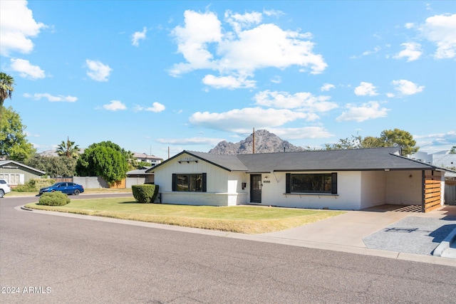 ranch-style house with a front lawn