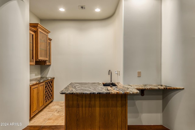 bar with indoor wet bar, recessed lighting, and visible vents