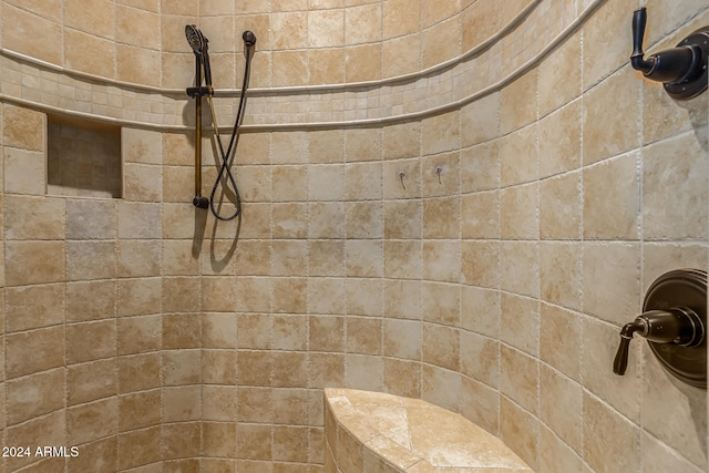 bathroom with a tile shower