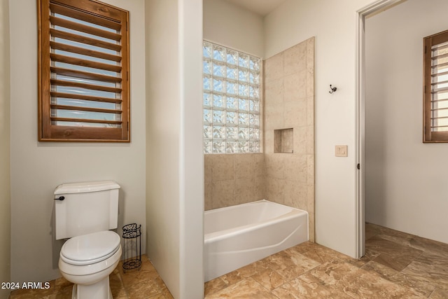 full bath featuring plenty of natural light and toilet